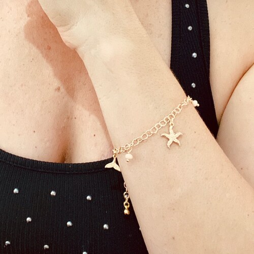 Pulsera con Estrella y Cola de Delfin-Baño de Oro 18K -Dorado.