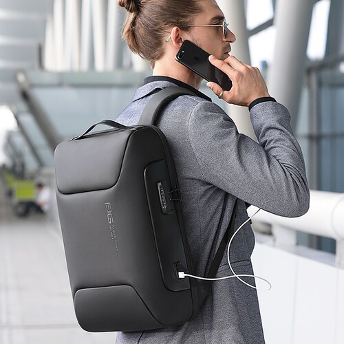  Mochila BANGE. Para laptop, iPad y artículos extra. Candado de seguridad antirrobo, puerto de carga USB y material repelente al agua. Modelo BG-7216