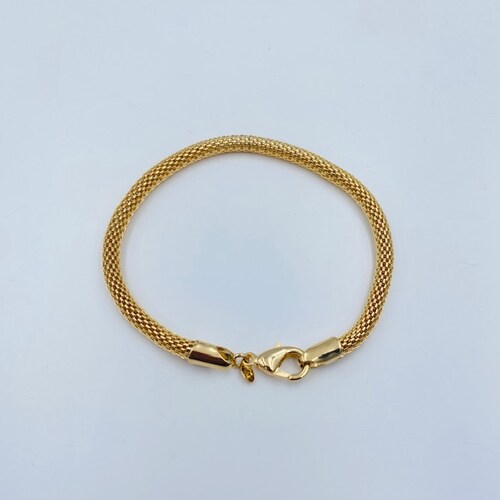 Pulsera Gruesa- Baño de oro 18K.