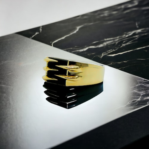 Anillo oro 10k piedra ónix de garra .