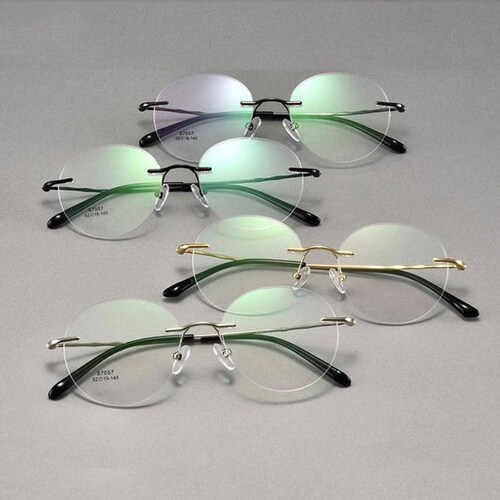 Anteojos con armazón de titanio MXTEX-008-3 2 Pzas Marco Oro Protección UV Titanio TitaniumElux.