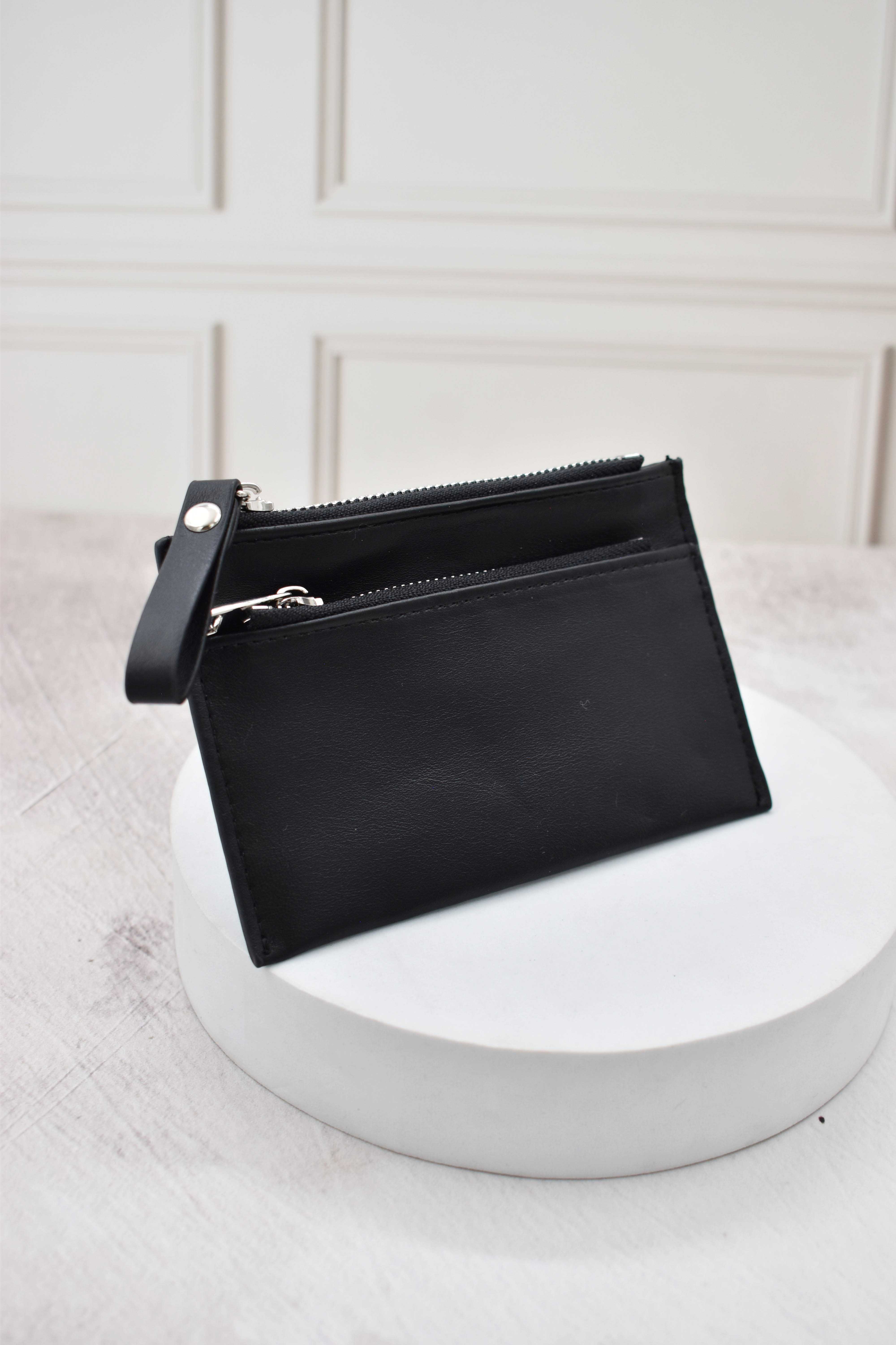 ADORN, Monedero con correa color negro 