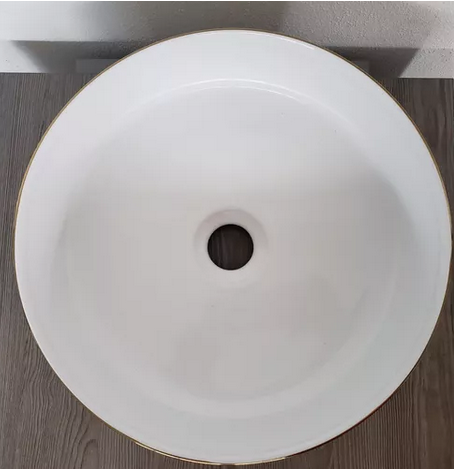 Lavabo Cerámico para Baño SAA, forma circular en color dorado con detalles en relieve metalizados. De sobreponer, con diseño europeo ideal para todo tipo de baños. Dimensiones 36.0 x 36.0 x 12.5 cms. (base x altura x profundidad)