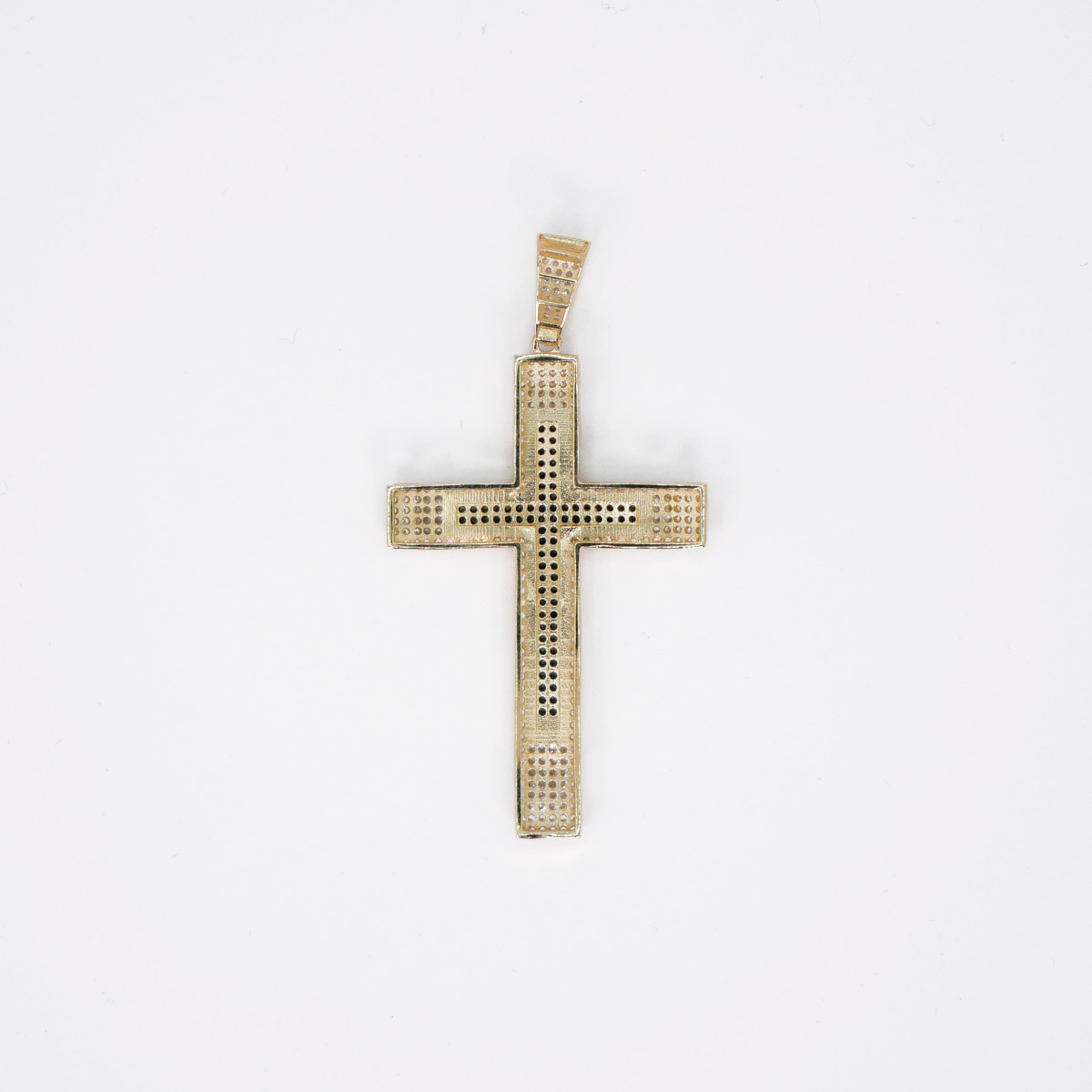 Dije Cruz de Oro 10k con piedra zirconia negra y blanca.