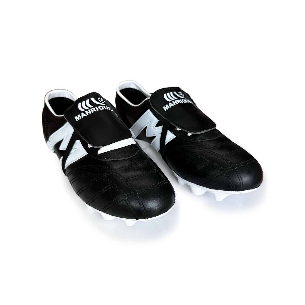 Zapatos  de futbol Tachos FG MANRIQUEZ Mid SX Negro/Blanco.