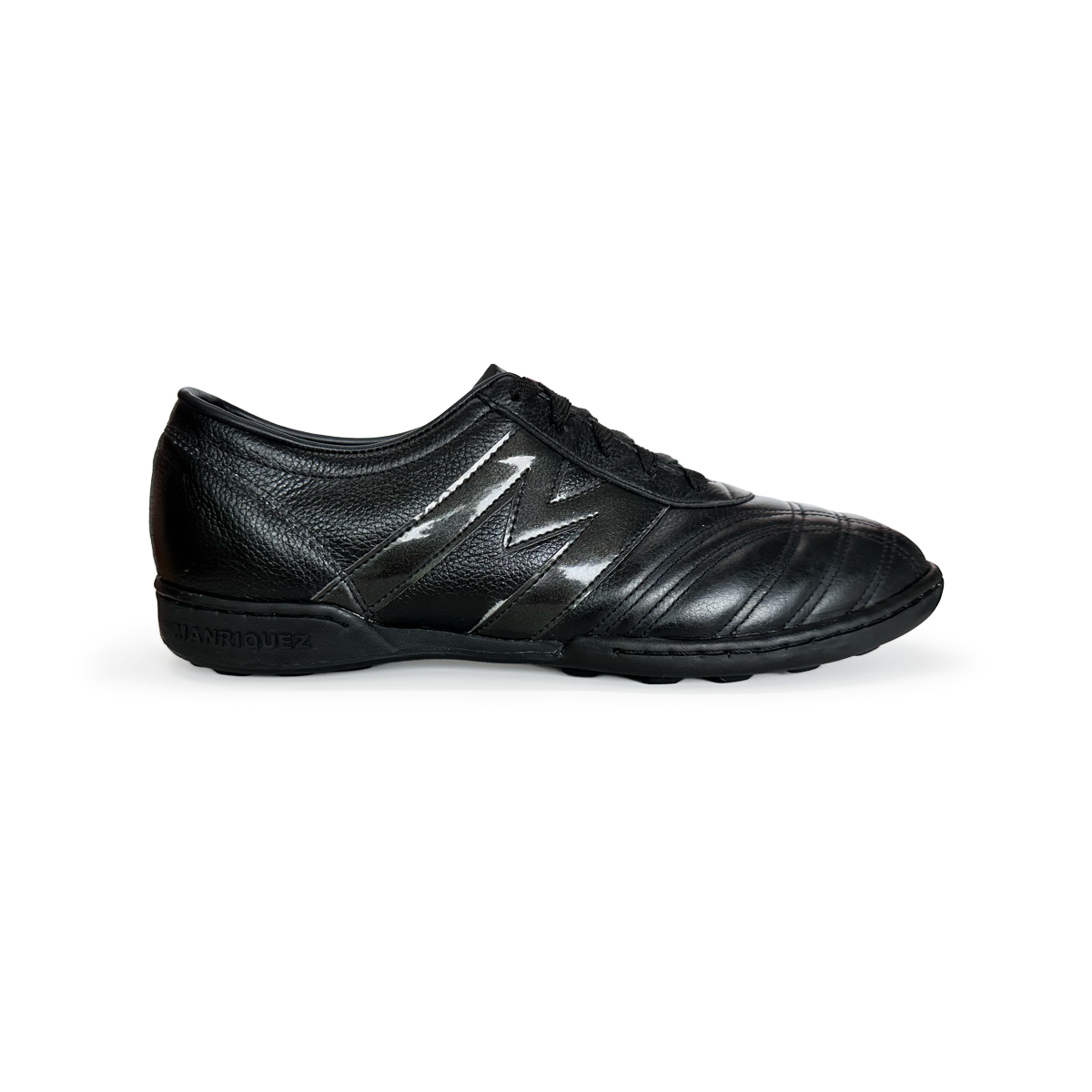 Tenis de futbol Rápido MANRIQUEZ Mid TM Total Negro.