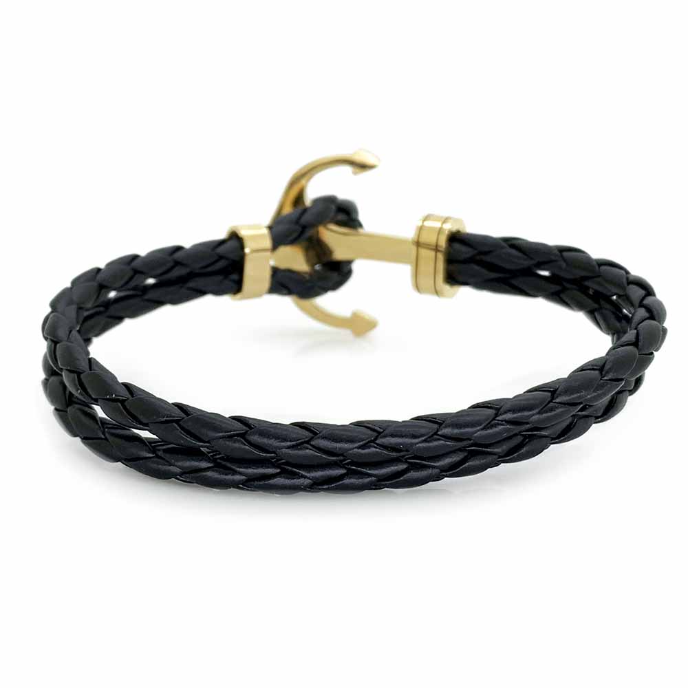 Pulsera Acero NK de piel trenzada con ancla dorada.