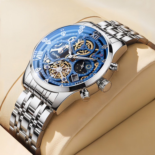 Reloj pulsera Skmei 7039 color plateado - fondo azul/negro.