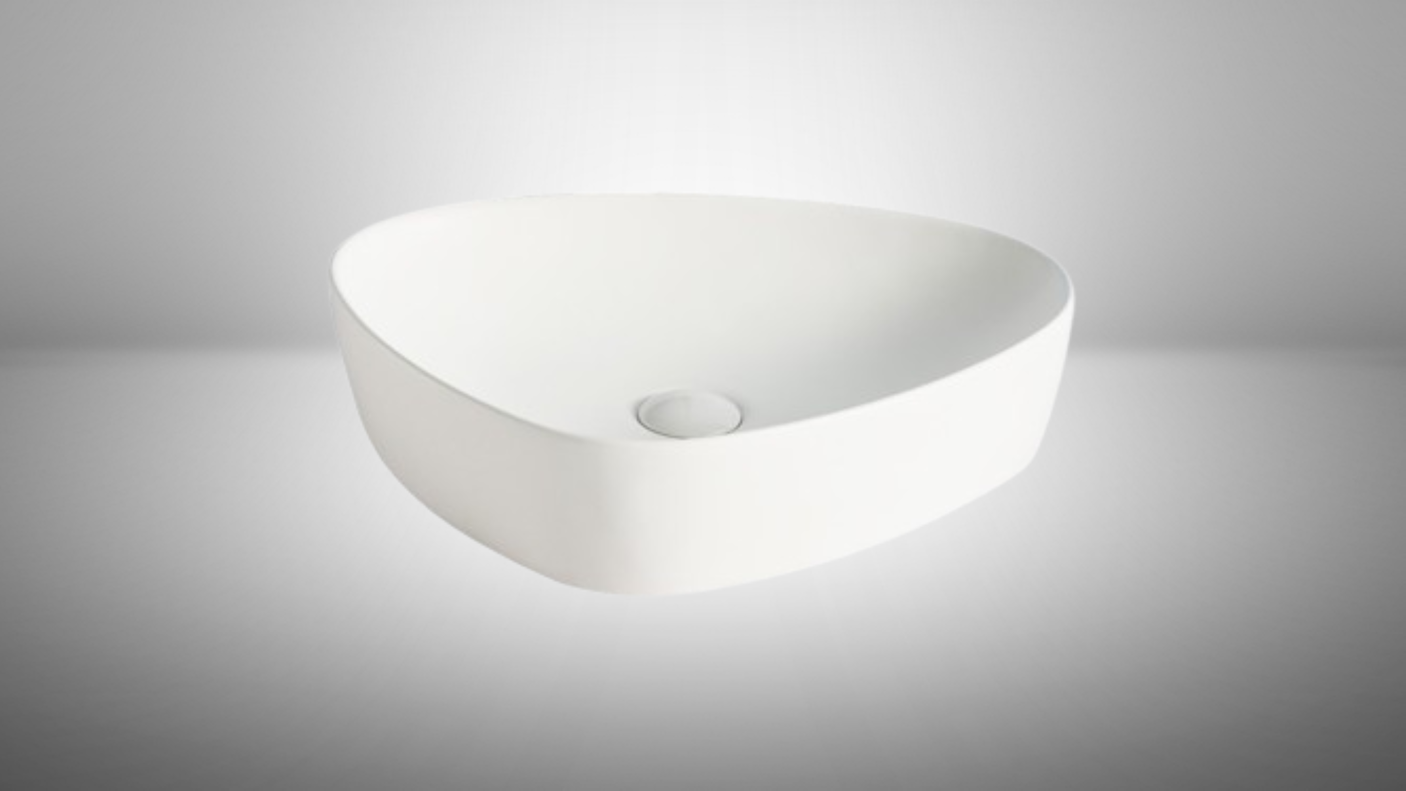 Lavabo Cerámico para Baño ARU, acabado blanco mate. De sobreponer, con diseño europeo ideal para todo tipo de baños. Dimensiones 50.0 x 40.5 x 12.0 cms. (base x altura x profundidad)