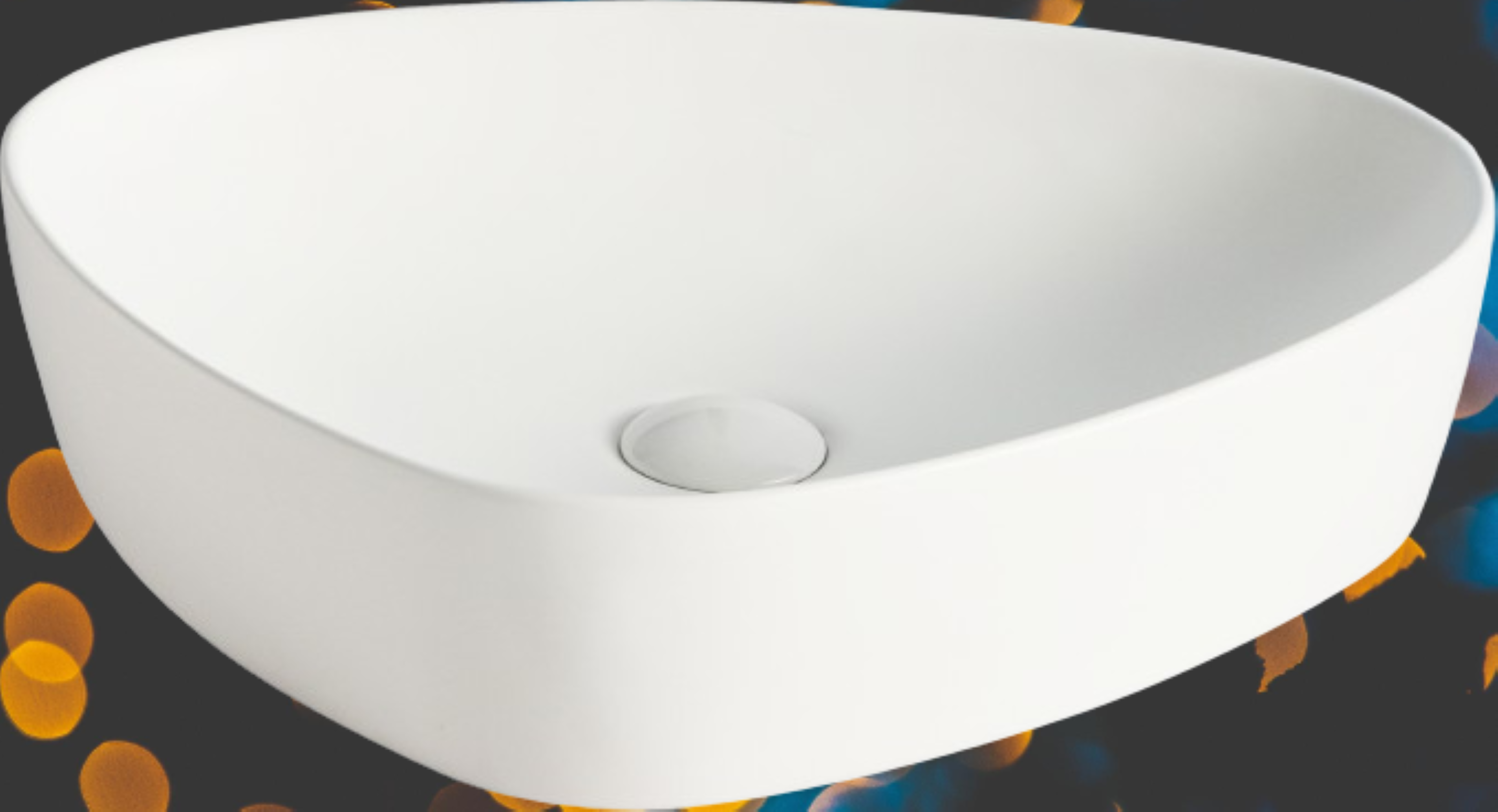 Lavabo Cerámico para Baño ARU, acabado blanco mate. De sobreponer, con diseño europeo ideal para todo tipo de baños. Dimensiones 50.0 x 40.5 x 12.0 cms. (base x altura x profundidad)