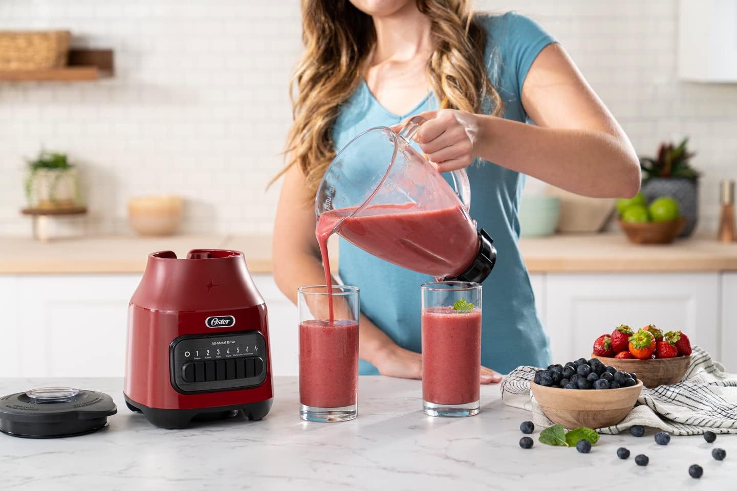 Oster Licuadora con Vaso de Vidrio y 6 Velocidades más Pulso