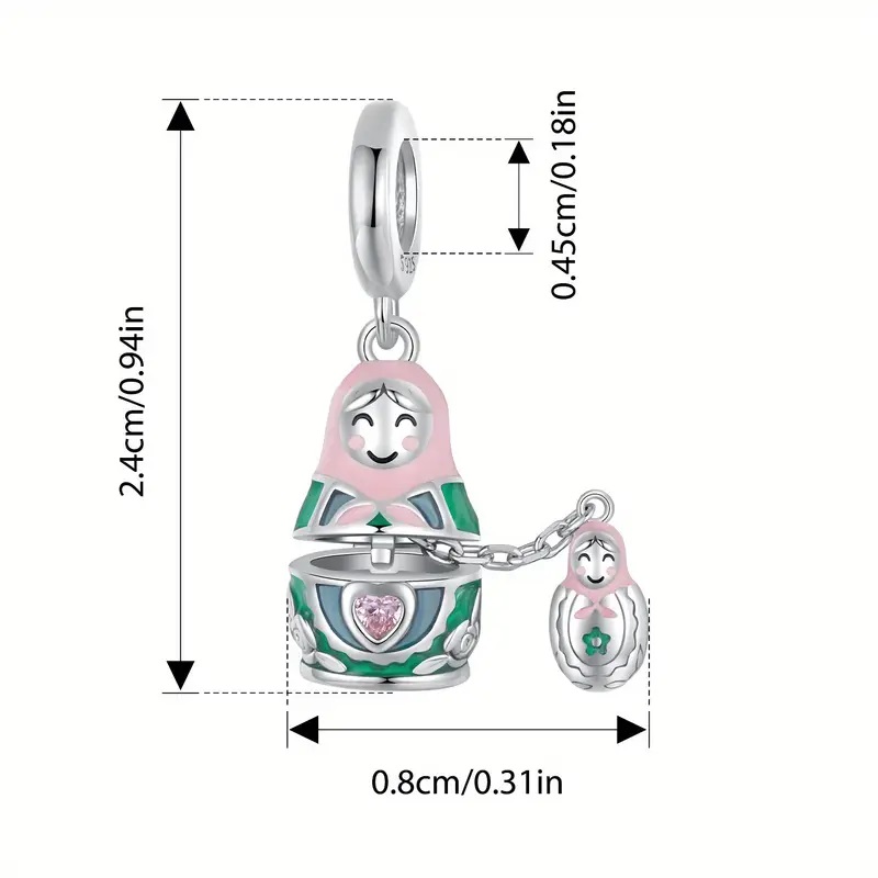 Dije Matryoshka tipo pandora plata 925 con baño de oro blanco
